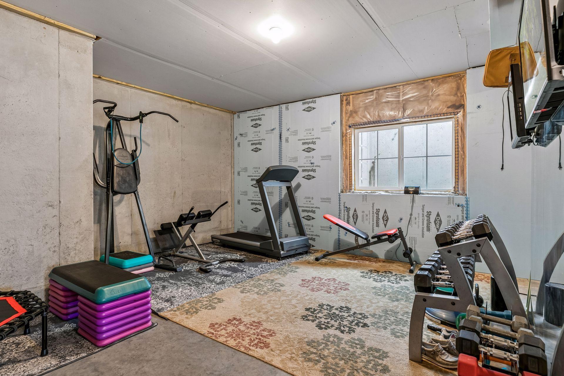 Currently a workout space, this room could easily become a sixth bedroom or private retreat.