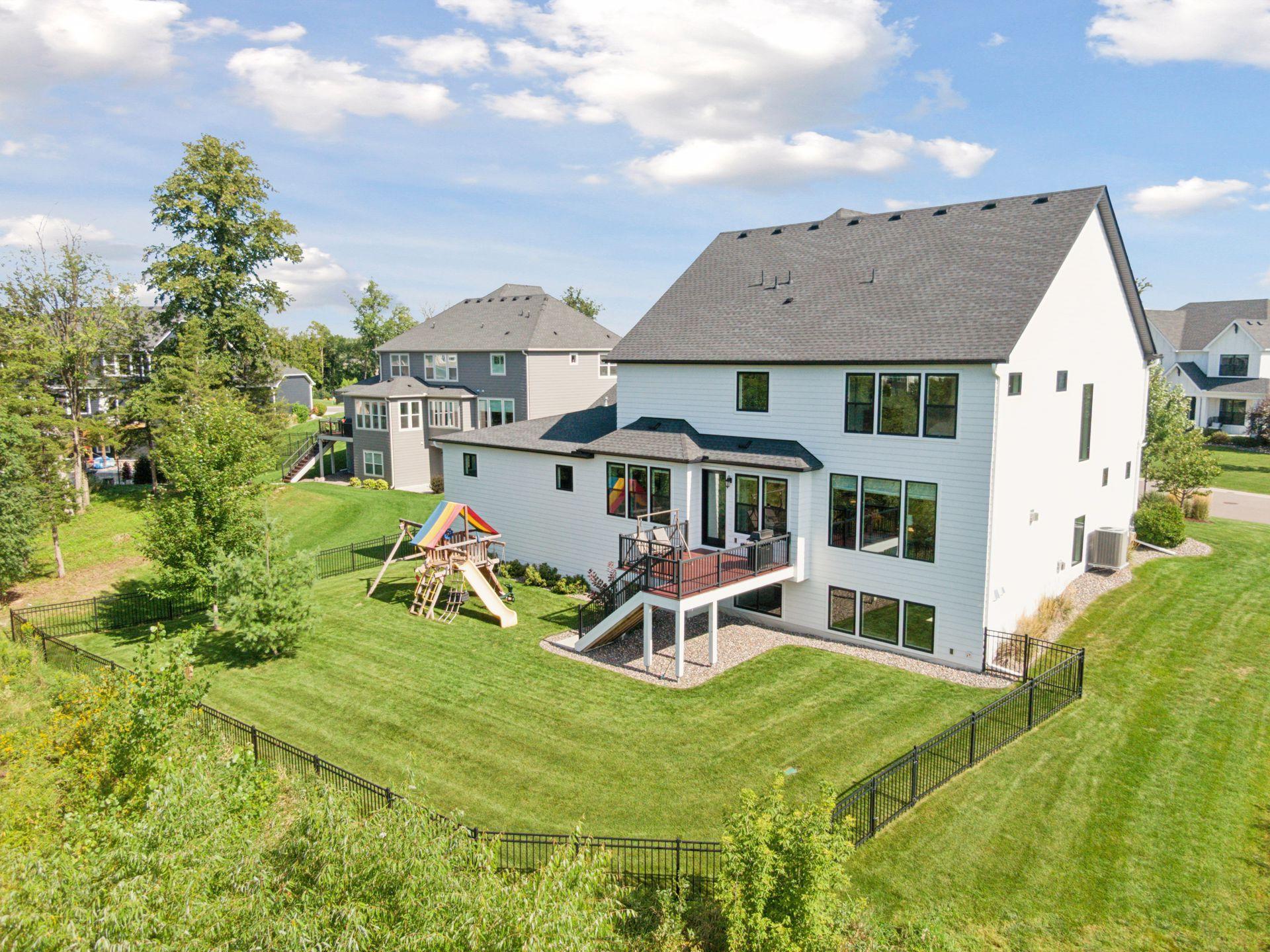 Fully fenced in with deck! Rainbow playset stays!