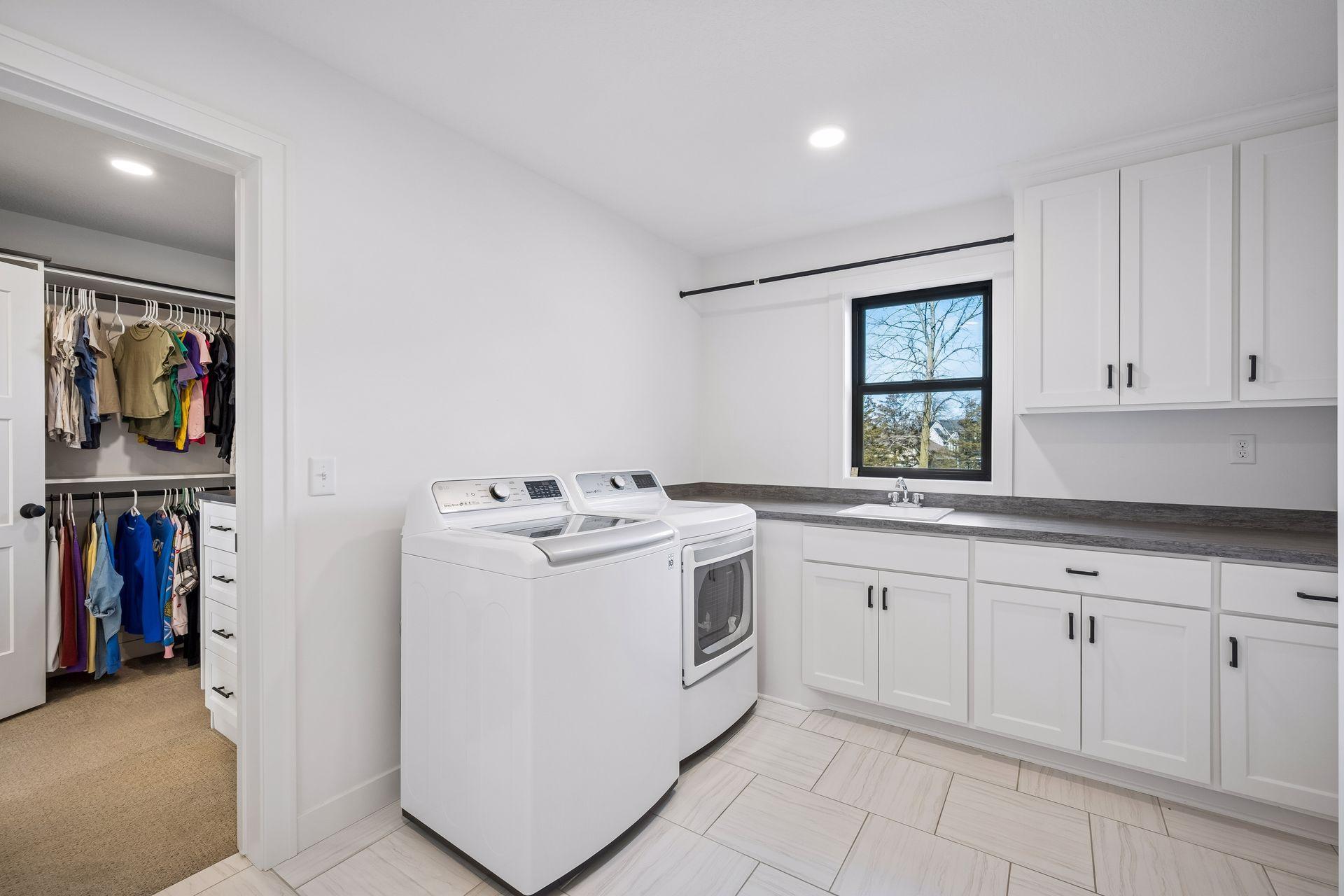 Upper level laundry room also connects with 1 of the primary closets.