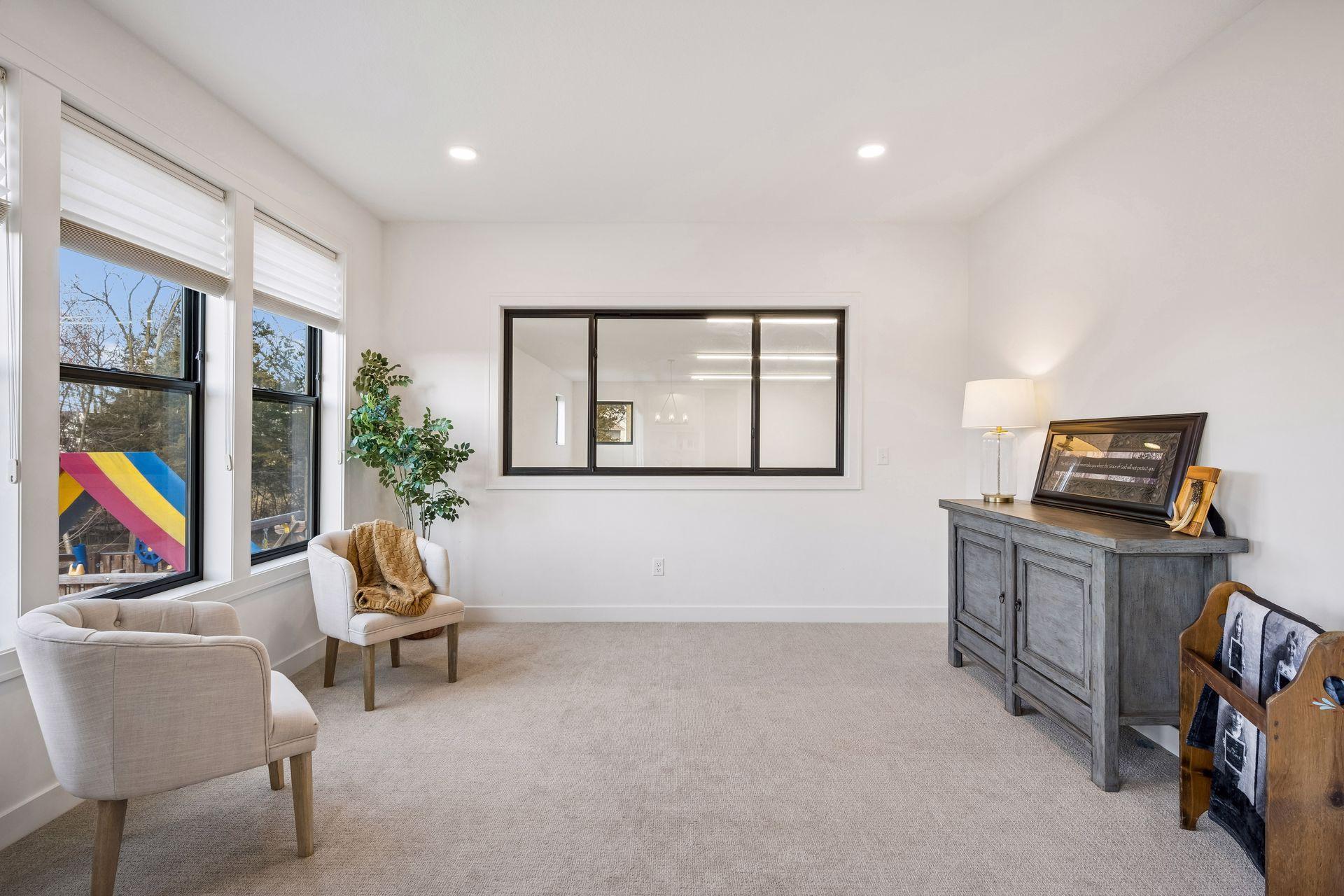 Off the dining room is the sunroom with window overlooking the sports court.