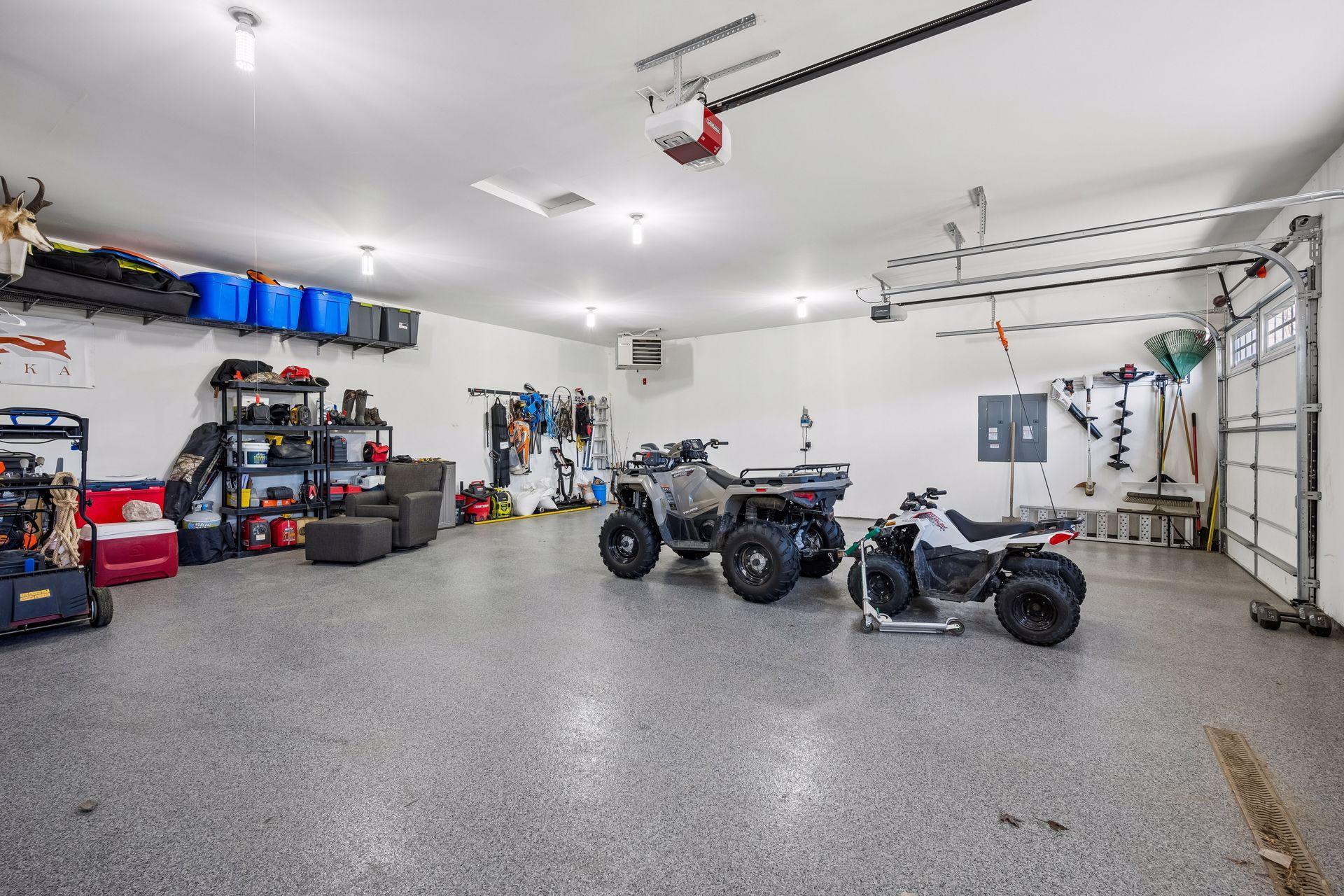 Huge 4 car garage is complete with epoxy flooring and garage heater.