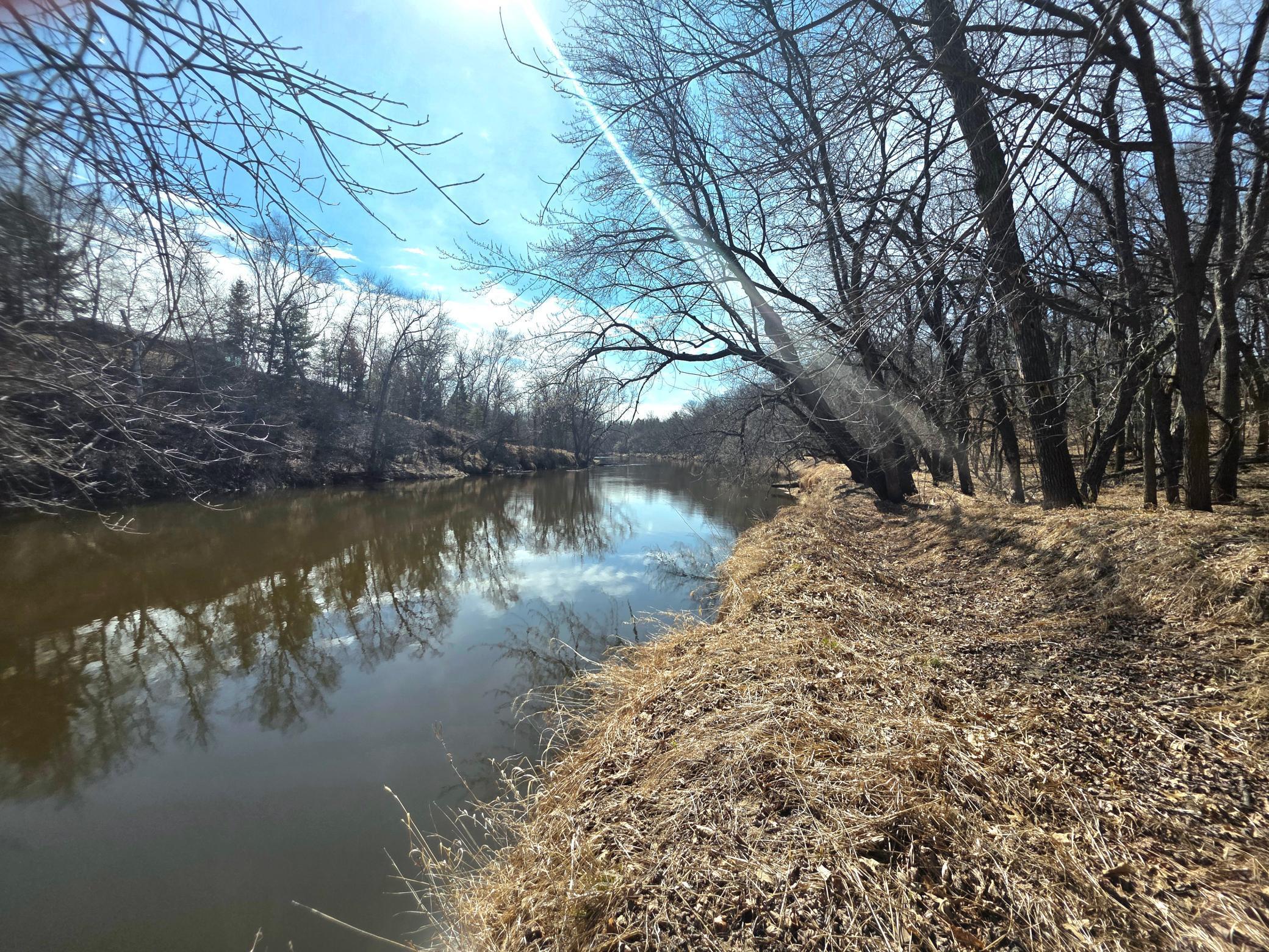 Enjoy river life on this beautiful 4 acre lot with 250 foot of Rum River frontage.