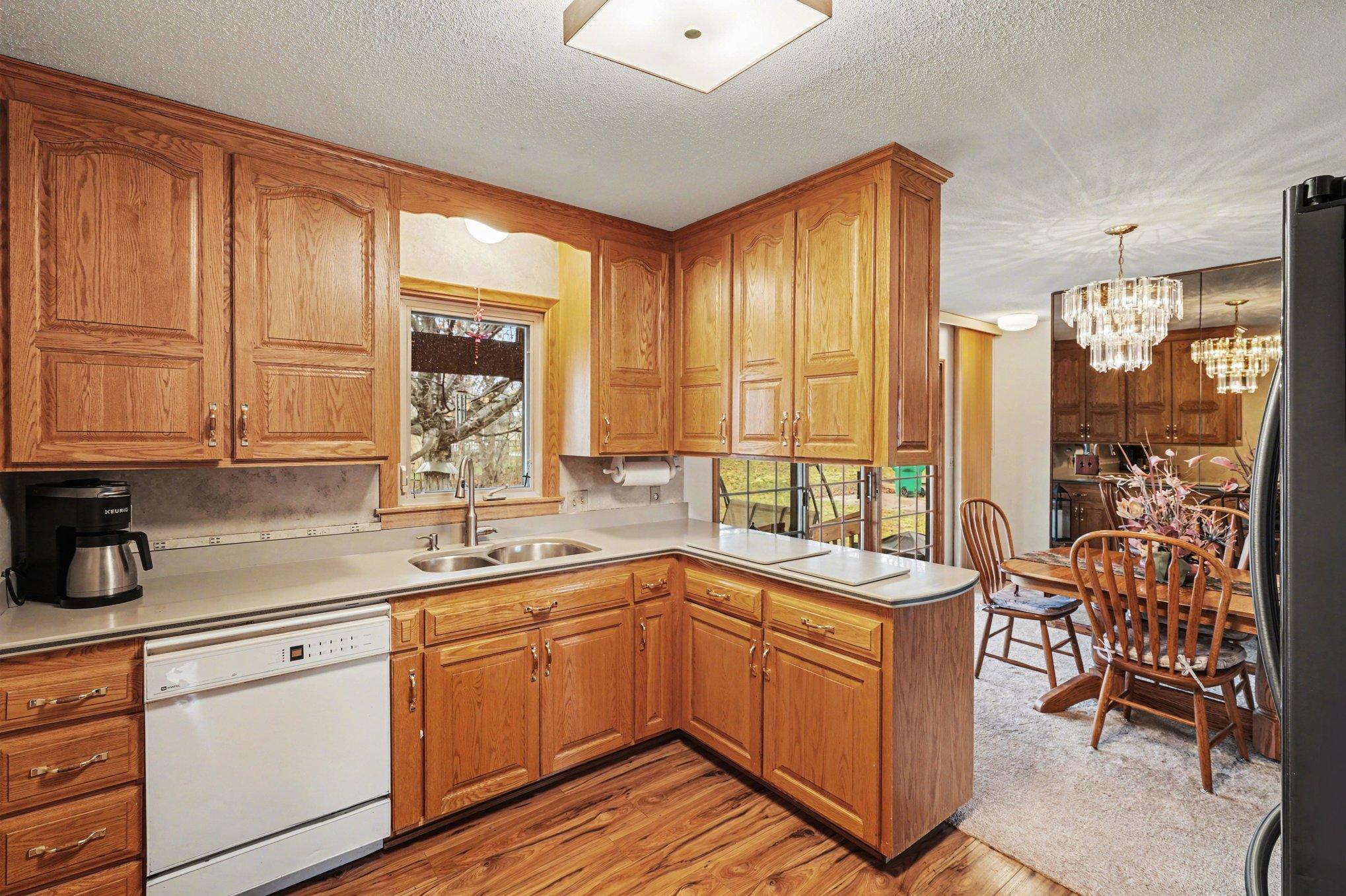 Kitchen has lots of cupboard space and solid surface Corian countertops