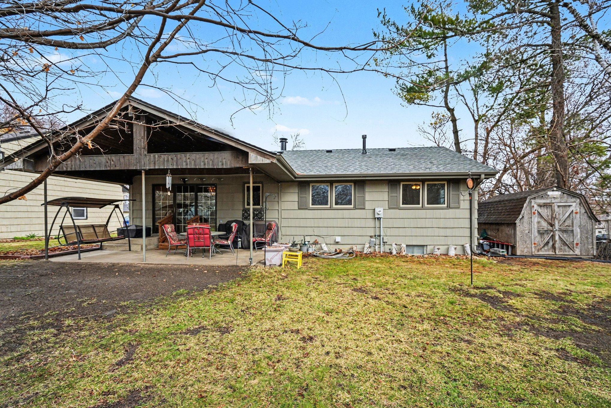Backyard covered porch is the perfect spot for relaxing and entertaining