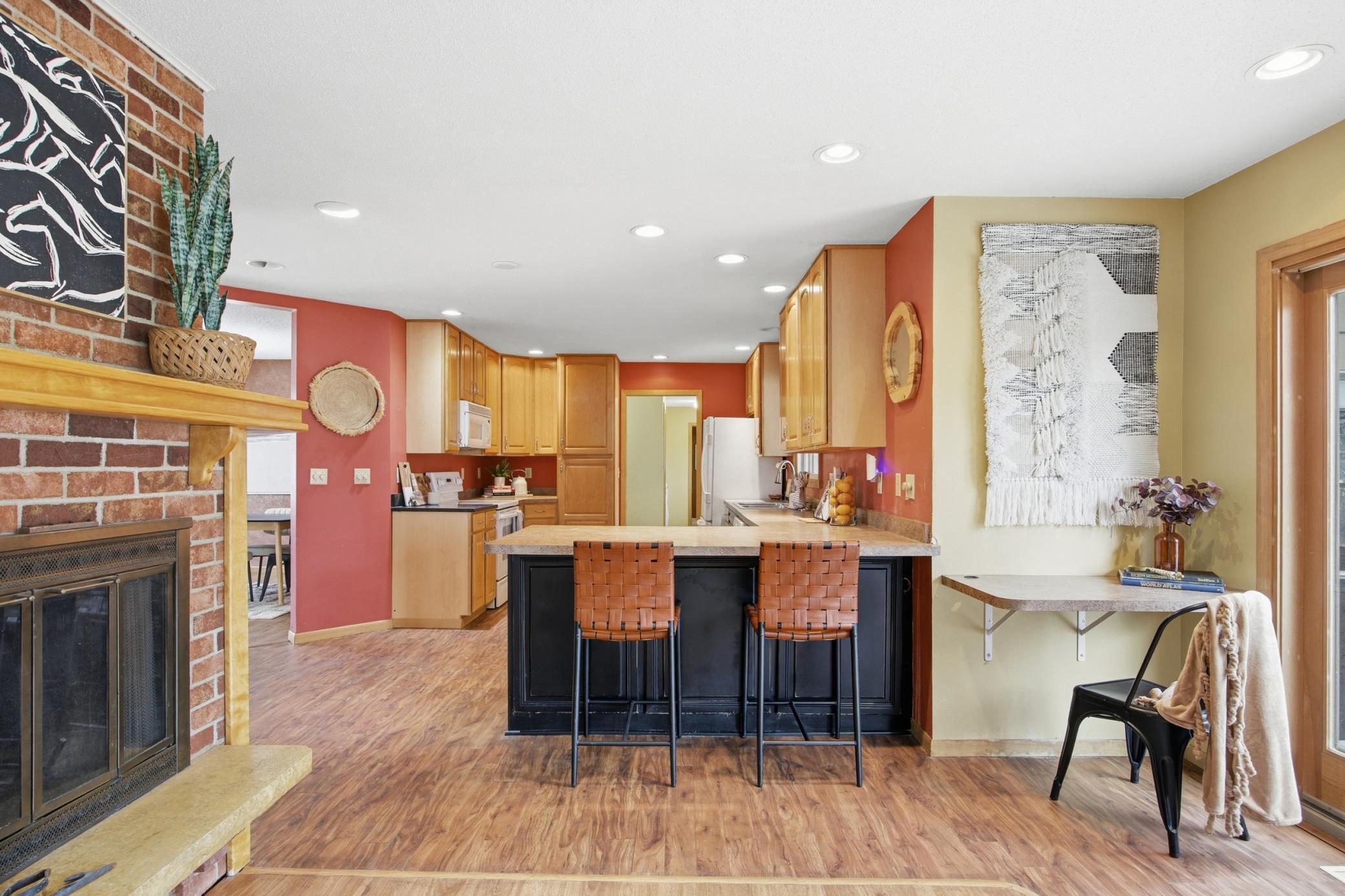 Kitchen with desk and fireplace!