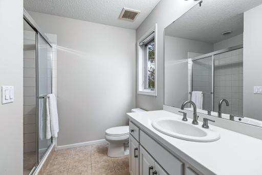 3/4 private bath connected to an upper level bedroom