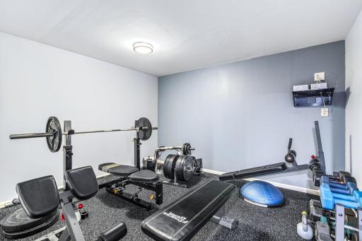 Lower level exercise room with gym flooring