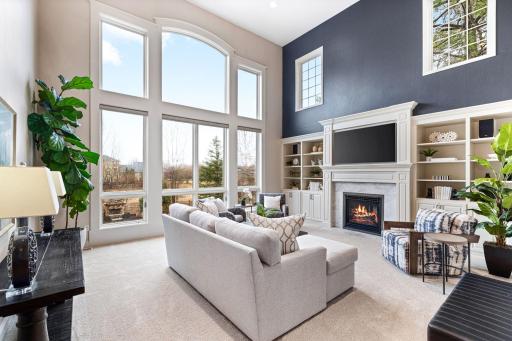 Main level family room with natural light and high ceilings
