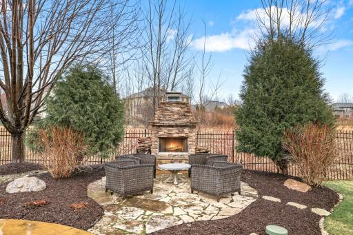 Beautiful stone fireplace with thoughtful landscaping