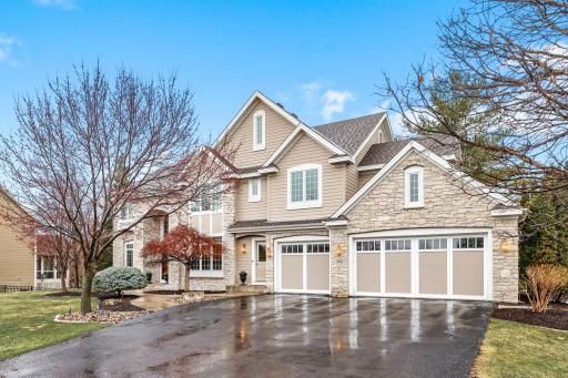Timeless exterior with a three car garage