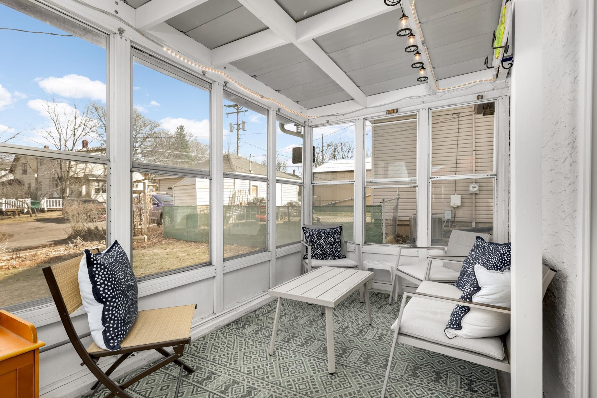 The sun porch off the dining room is a charming spot - perfect for morning coffee or afternoon happy hours with friends.