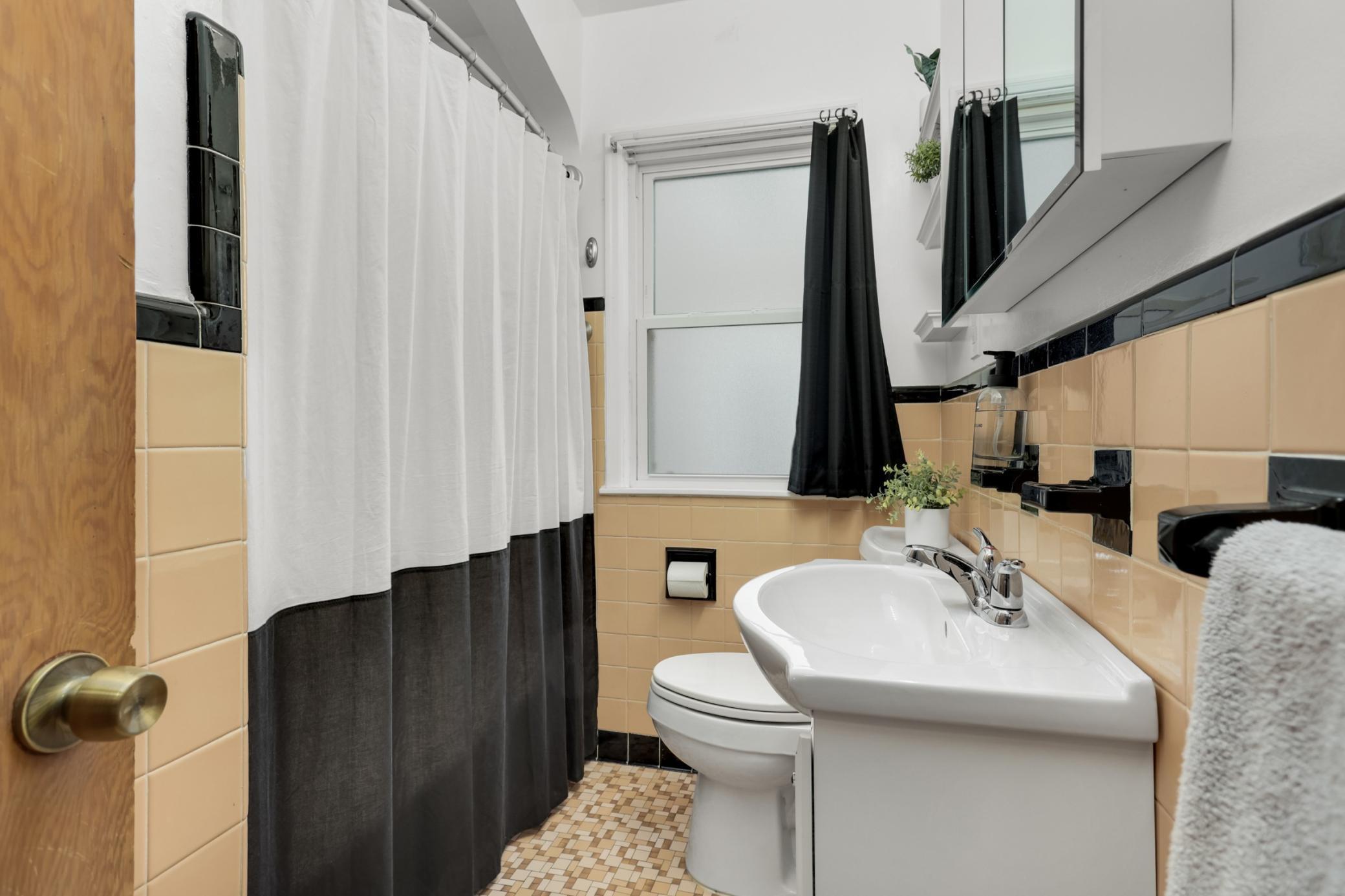 The original tile is in beautiful condition and is a great nod to the era.