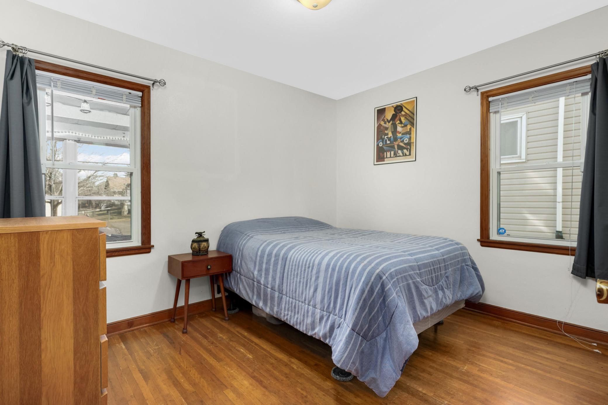 The secondary bedroom on the main floor overlooks the backyard.