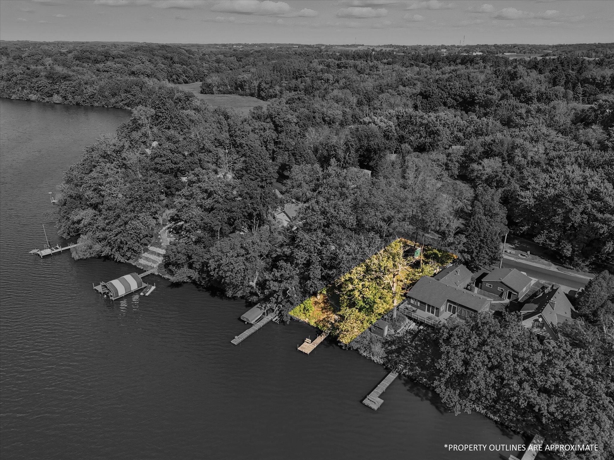 Aerial view of lakeshore with lot highlighted