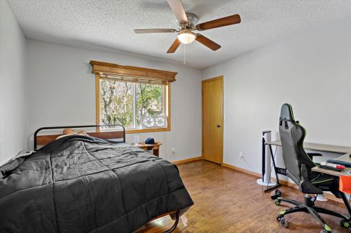 Upper level 2nd BR w/walk in closet and ceiling fan.