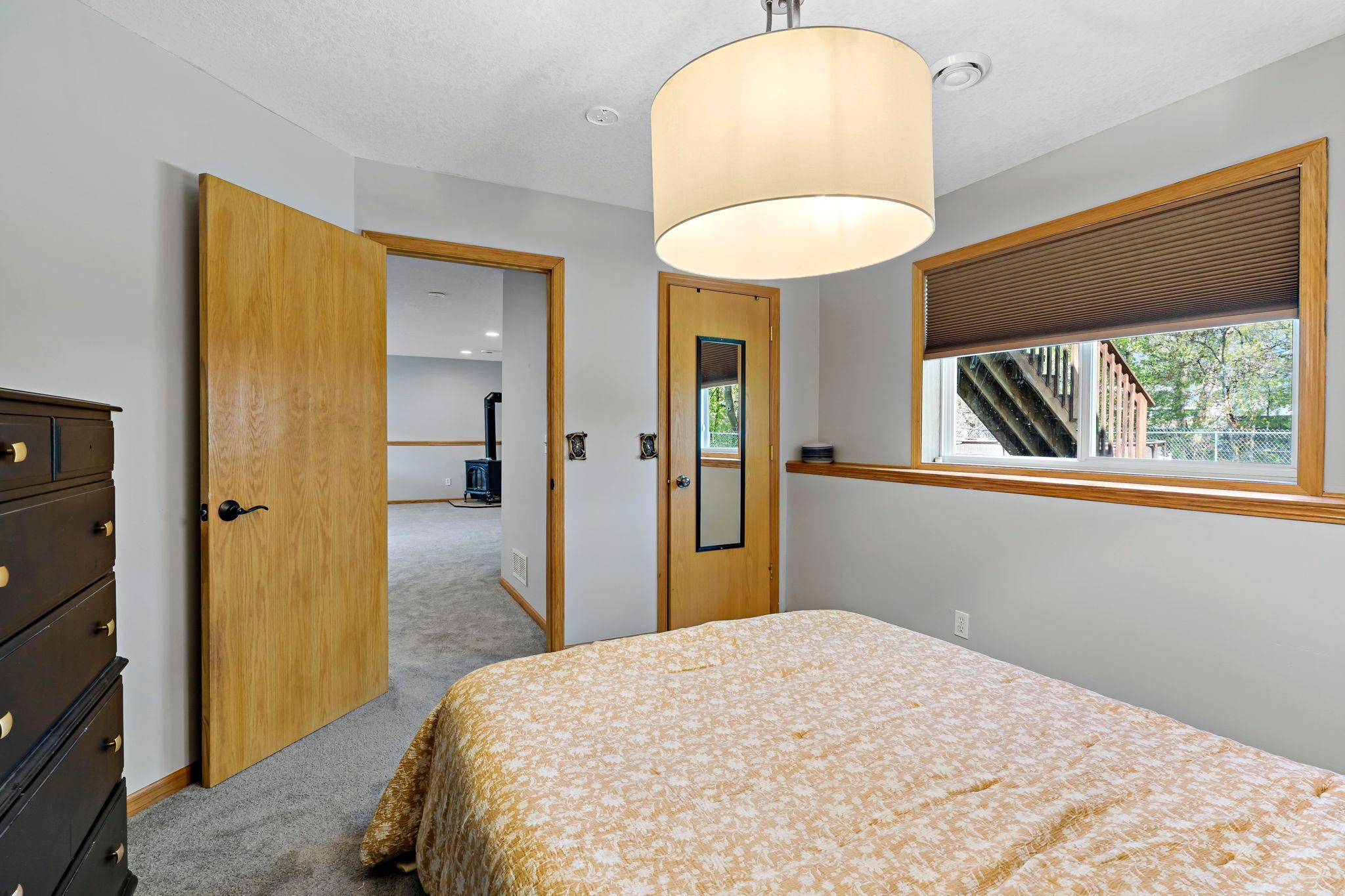 Lower level bedroom with closet.