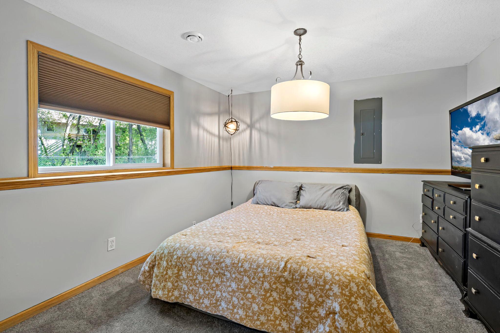 Lower level bedroom with brand new carpet