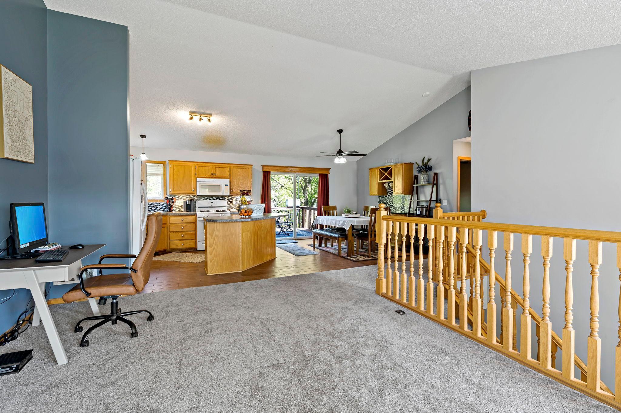 Living room with open floor plan with kitchen and dining area...great for entertaining.