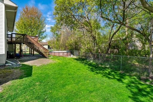 Fenced in back yard with above ground pool.