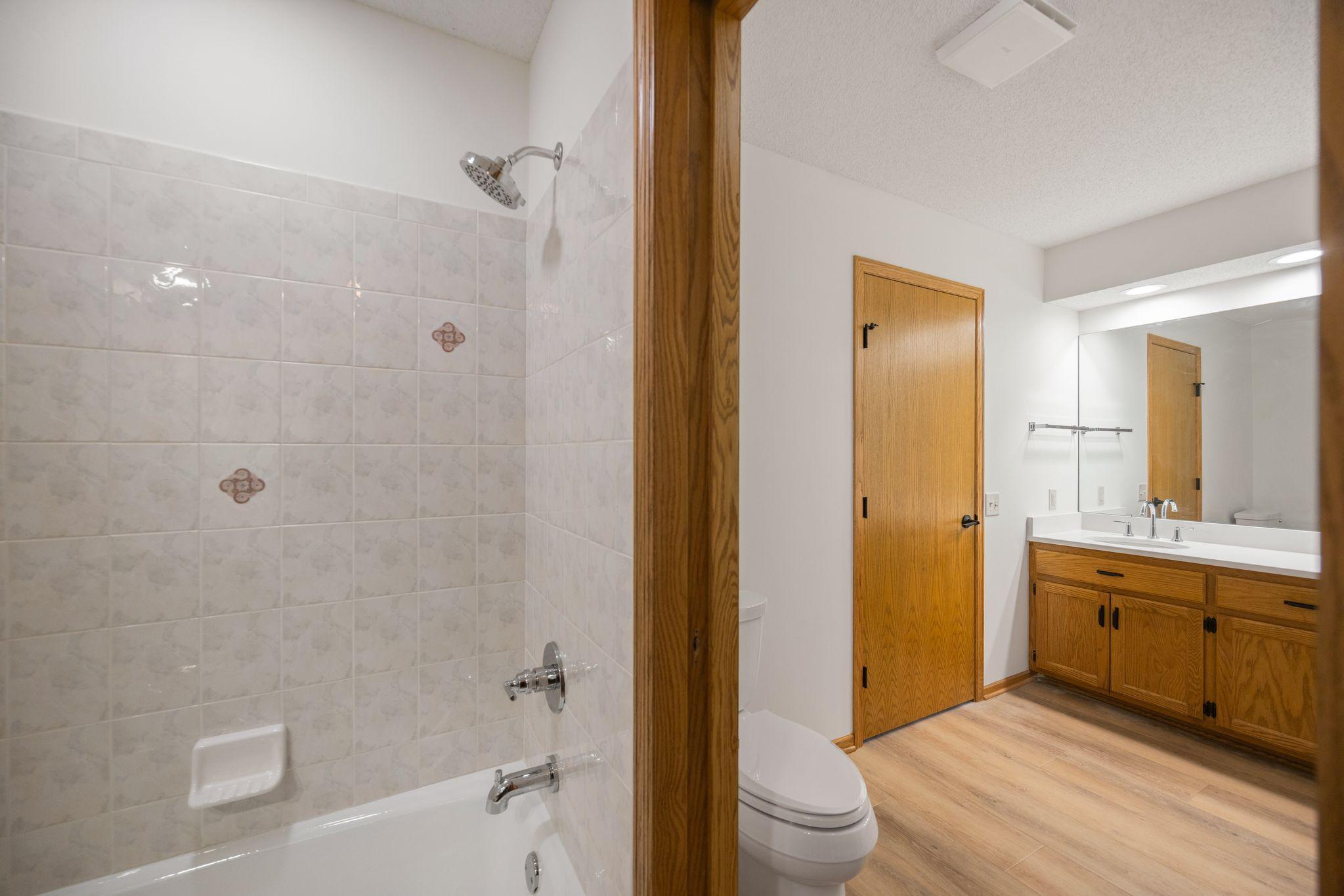 Main Level Bathroom connecting to the primary bath with shower