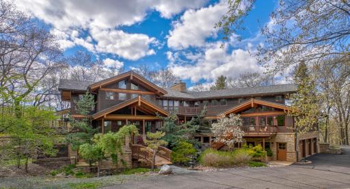 The beautiful cedar and stone exterior is embellished by the Japanse-influenced landscape design.