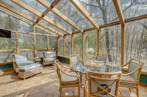 The Lindal Cedar sun room faces south with views in three directions.