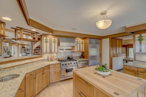 The spacious kitchen with its Viking stove and SubZero refrigerator. There is a convenient office nook to the right.