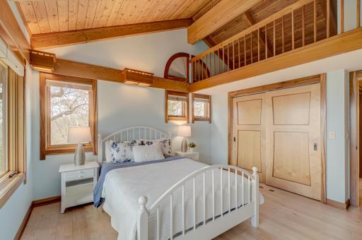 The two additional bedrooms on the upper level have ladders inside the closets to access the play space up above.