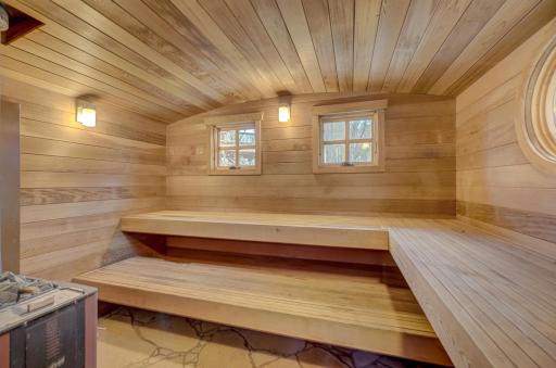 Wood fired sauna with stone floor.