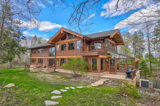 There is a stone patio for grilling outside the kitchen sunroom.