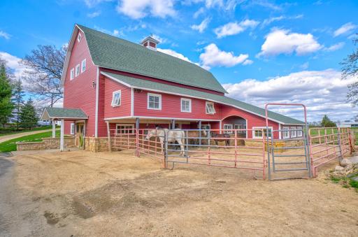 The original barn was restored and given a new foundation. The chicken coop is on the right side of the archway.