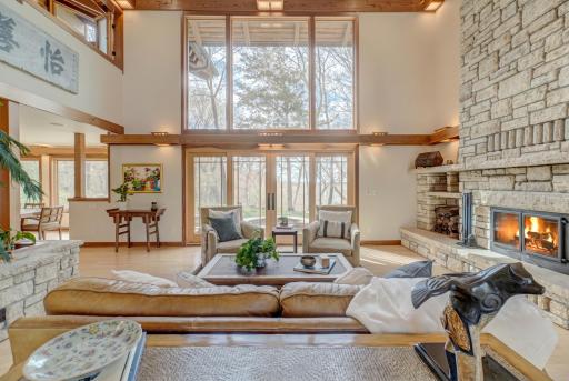Two stories of windows bring sunset views from across the lake.