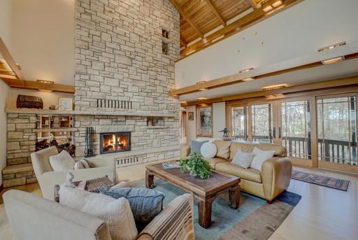 The magnificent two story St Croix stone fireplace anchors the home. There is a deck to the east with views toward the barns and rolling hills.
