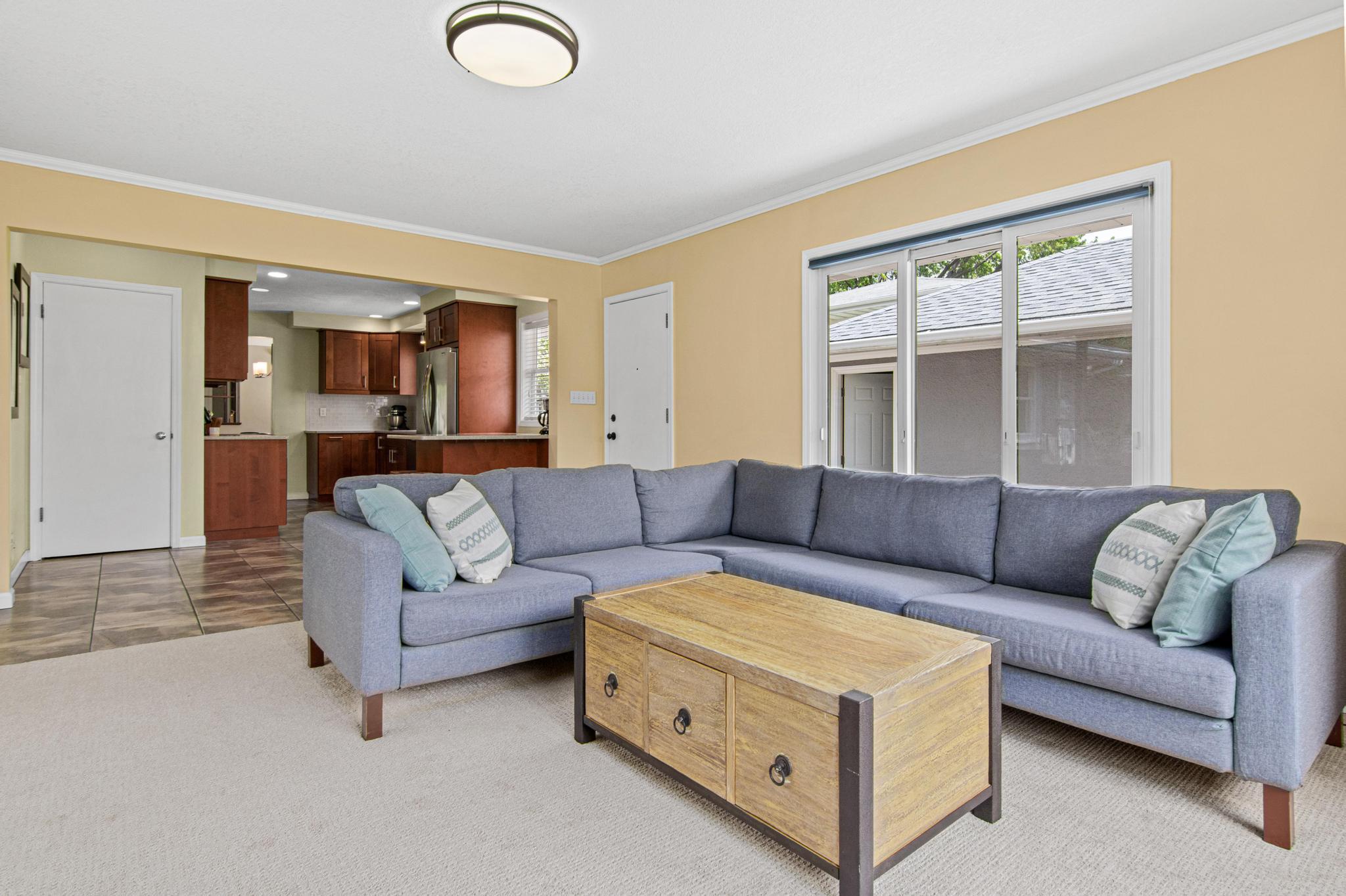 The main floor family room addition provides additional community living space not commonly found in Roseville ramblers.