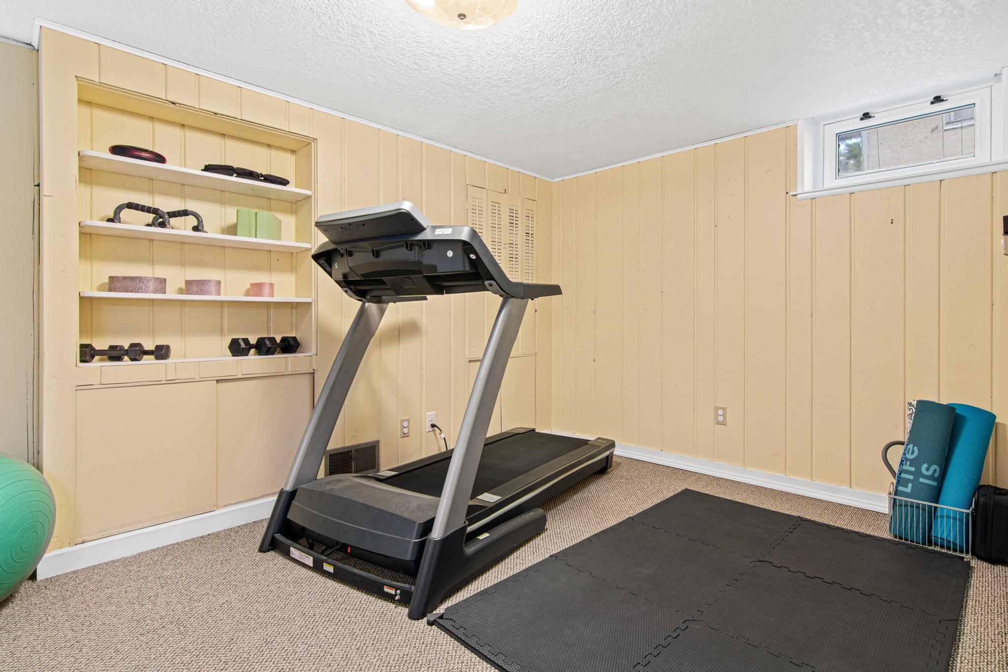 This lower level room could work as a dedicated office, non-conforming bedroom, or be converted to a legal bedroom with the addition of an egress window.
