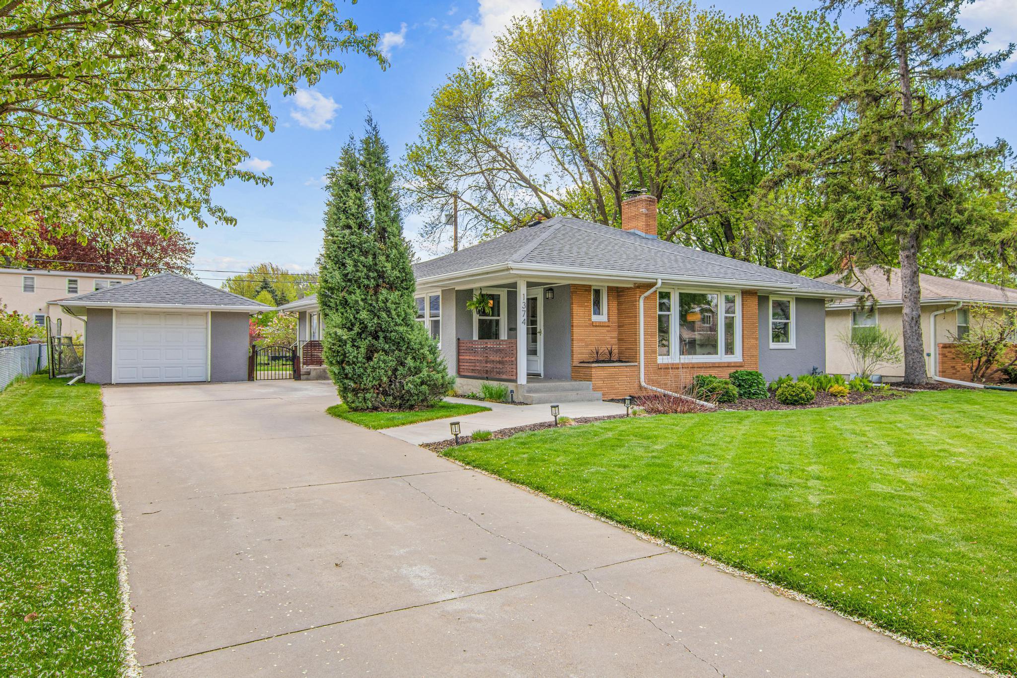 The front yard landscape was updated in 2024 and features low maintenance perennials and shrubs that will look beautiful all summer long with minimal effort.