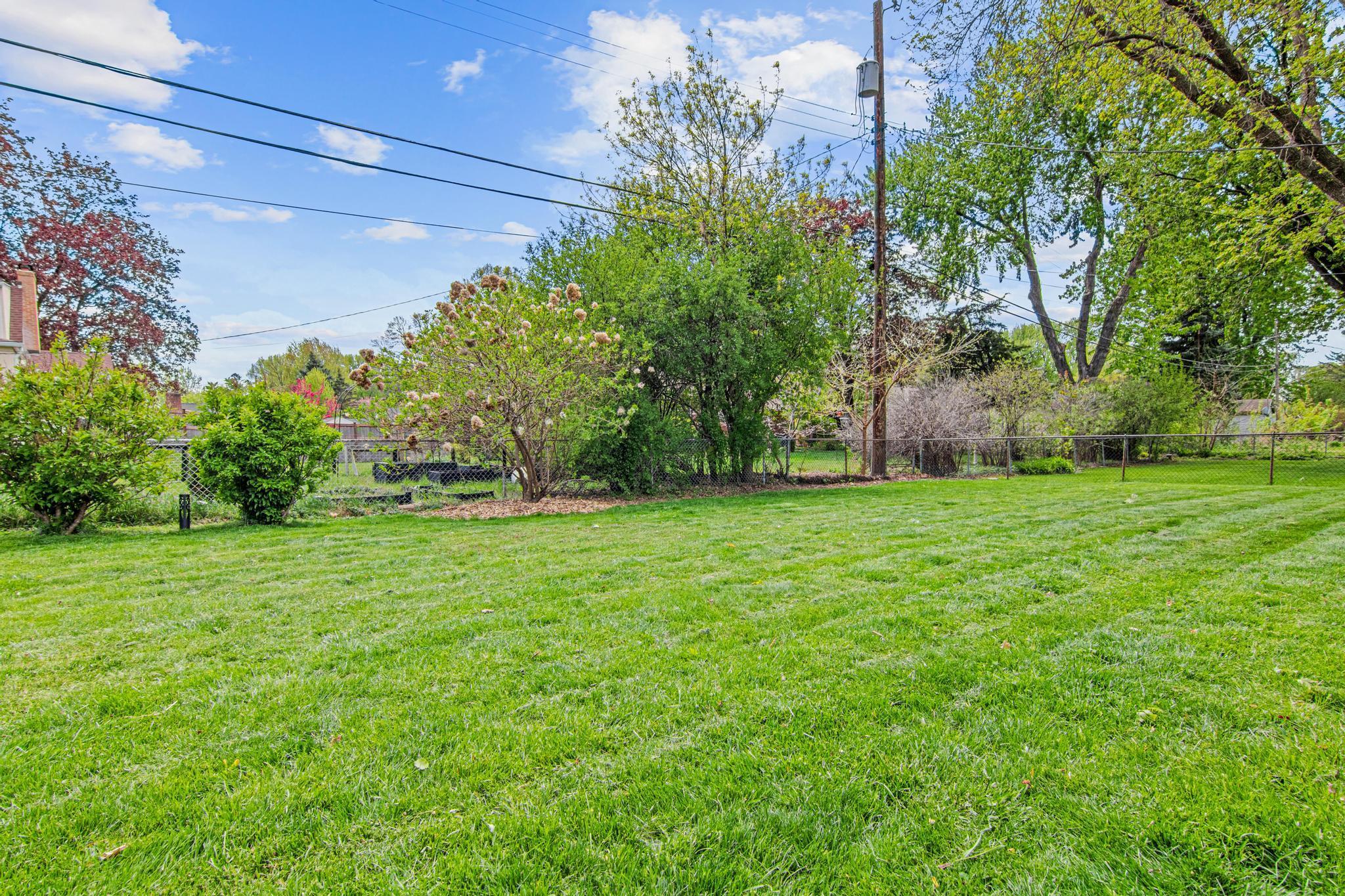 The large, fenced, and flat yard are perfect for all members of the family.