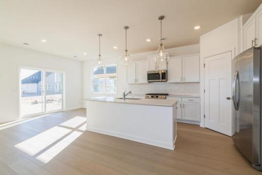 (Photo of similar home, features will vary) This open-concept layout is perfect for gatherings. **NOTE: This kitchen will be gourmet.