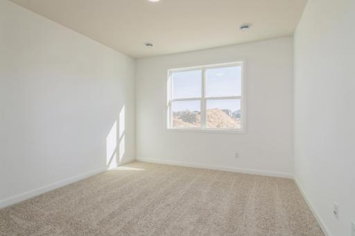 (Photo of similar home, features will vary) The spacious primary suite is large enough for a king-sized bed and accessories.