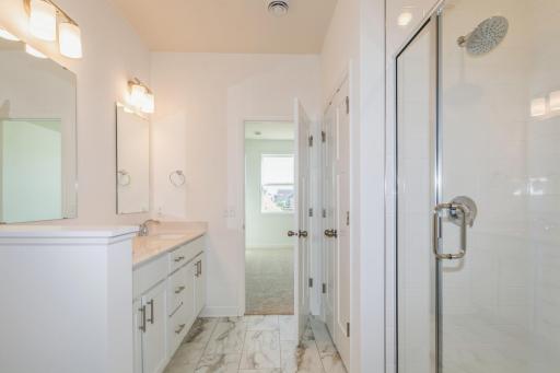 (Photo of similar home, features will vary) Another view of the primary bath.