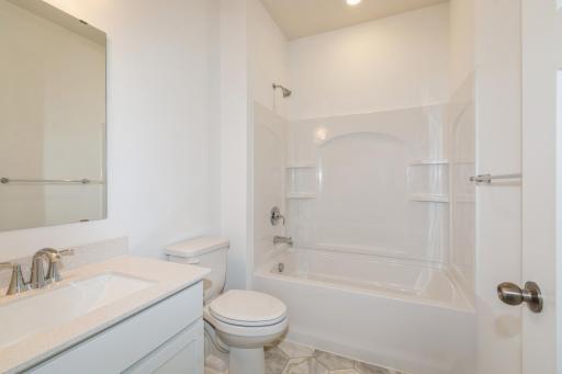 (Photo of similar home, features will vary) The secondary bath.