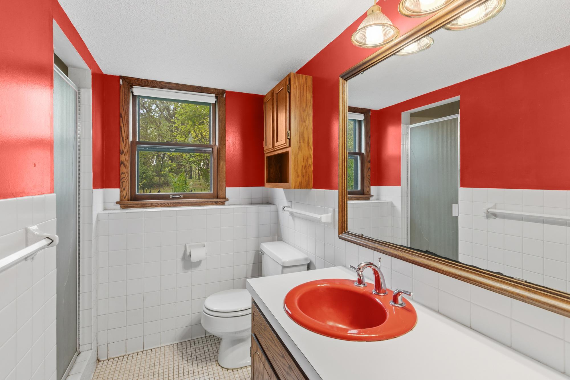 The lower level three-quarter bath sits just outside the two bedrooms.