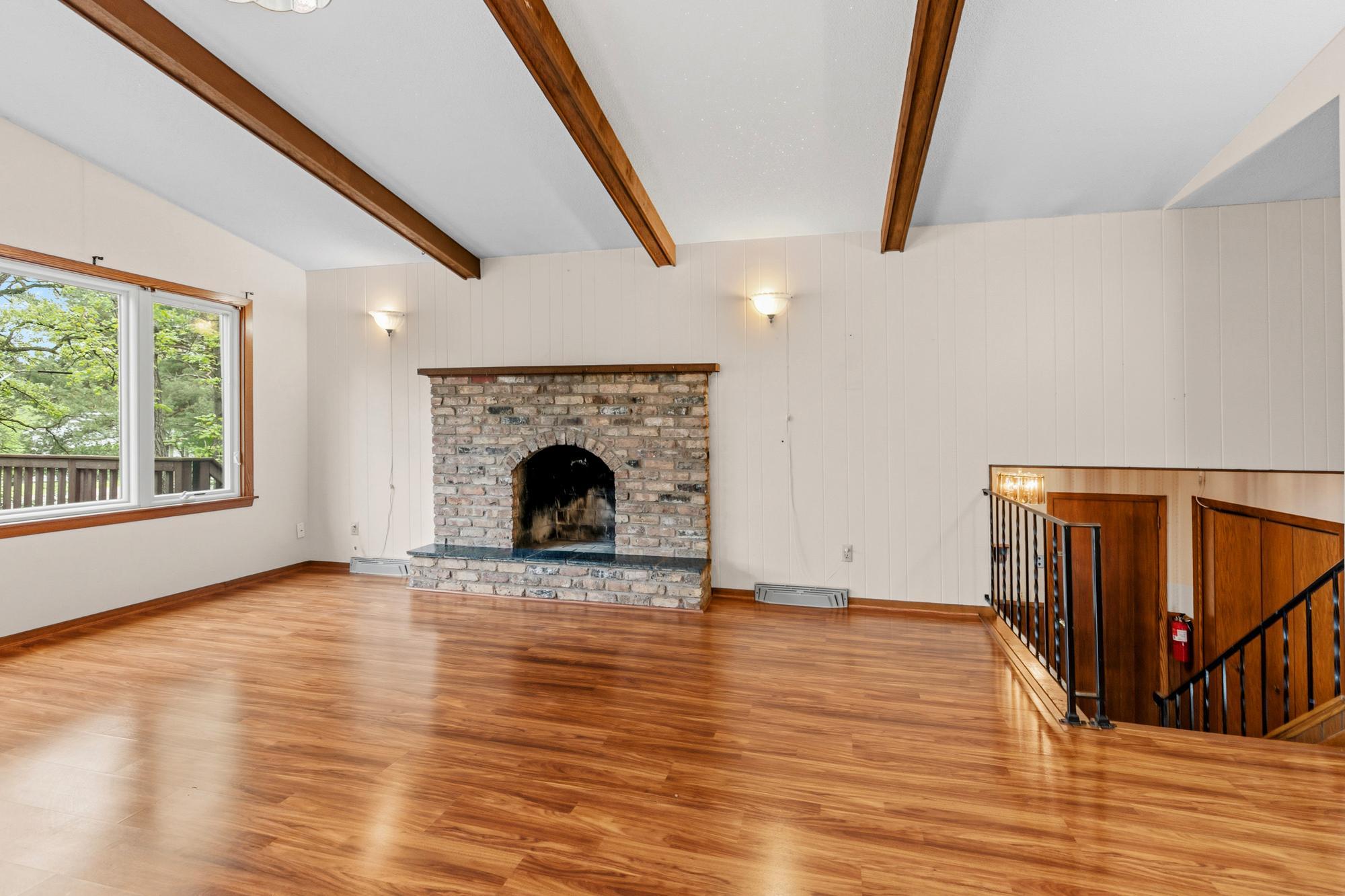 Custom, wrought iron railings to the entry area include a matching gate to keep littles and pets where they are meant to be.