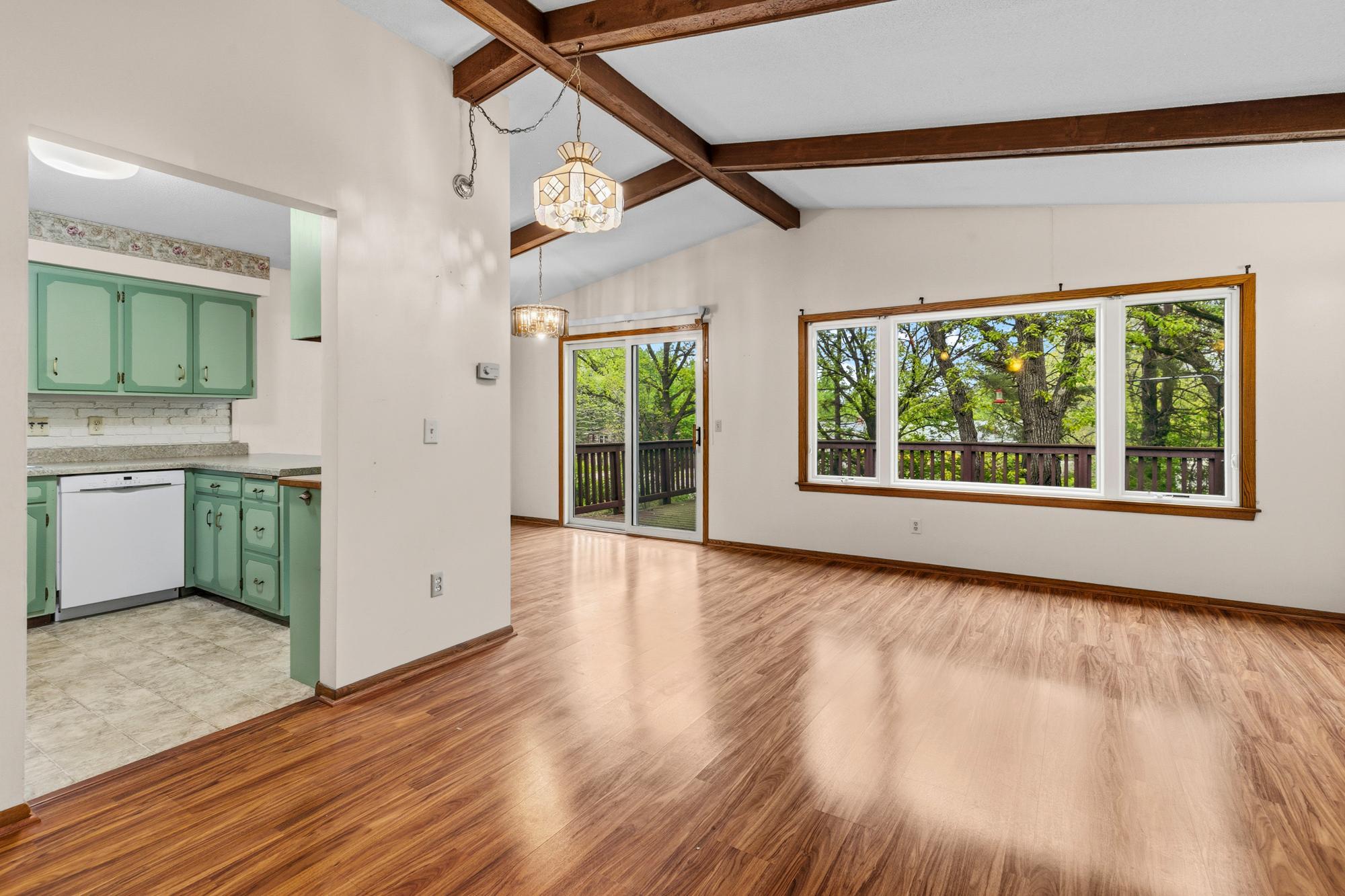 Both the sliding glass doors and picture window have been recently replaced for enhanced views out to the tree-covered front yard.