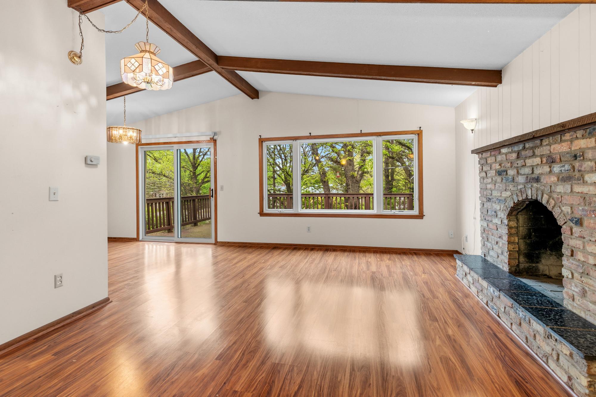 The living room is home to one of two wood-burning fireplaces.