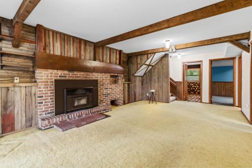 Rustic woodwork and faux beams give this room a cabin-y feel.