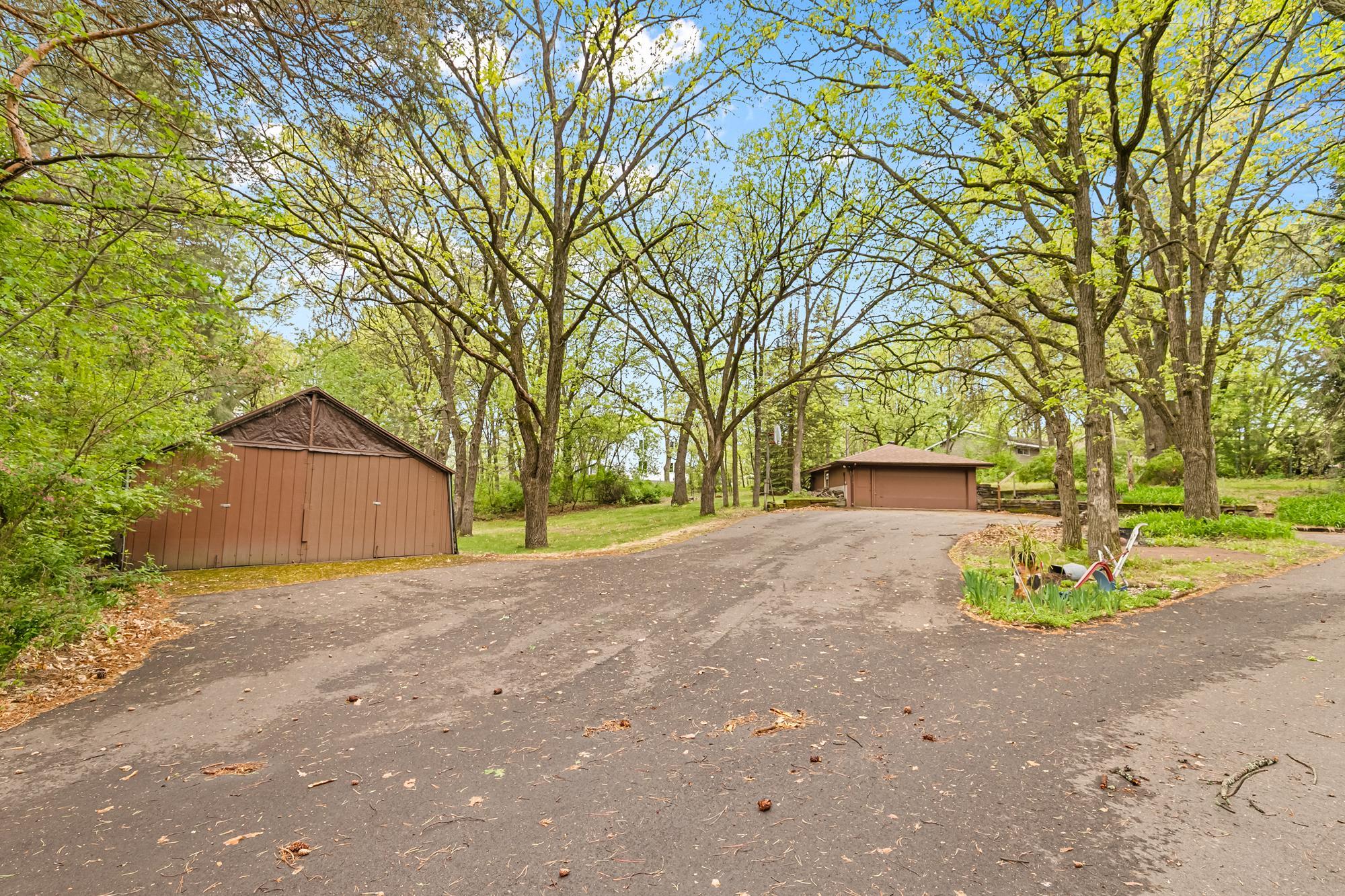 Along with the attached garage, this property features a secondary detached garage and a lean-to shed for storage of trailers, boats, extra cars, lawn-care items, or anything else you might need to store away from the elements.