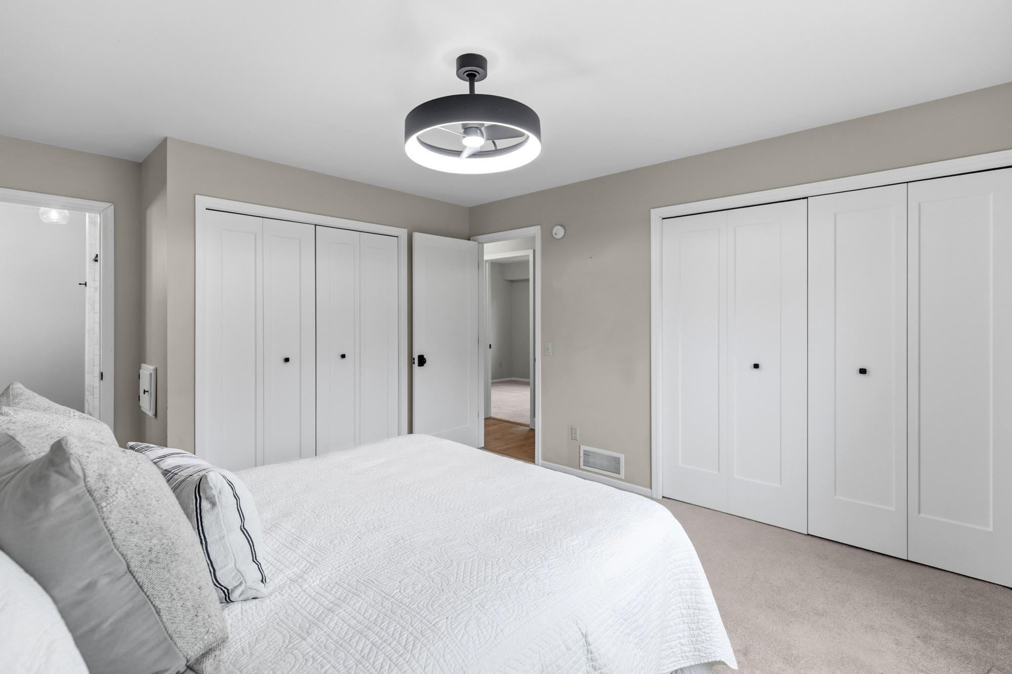 The primary suite boasts his and hers closets, and an en suite, three-quarter bath.