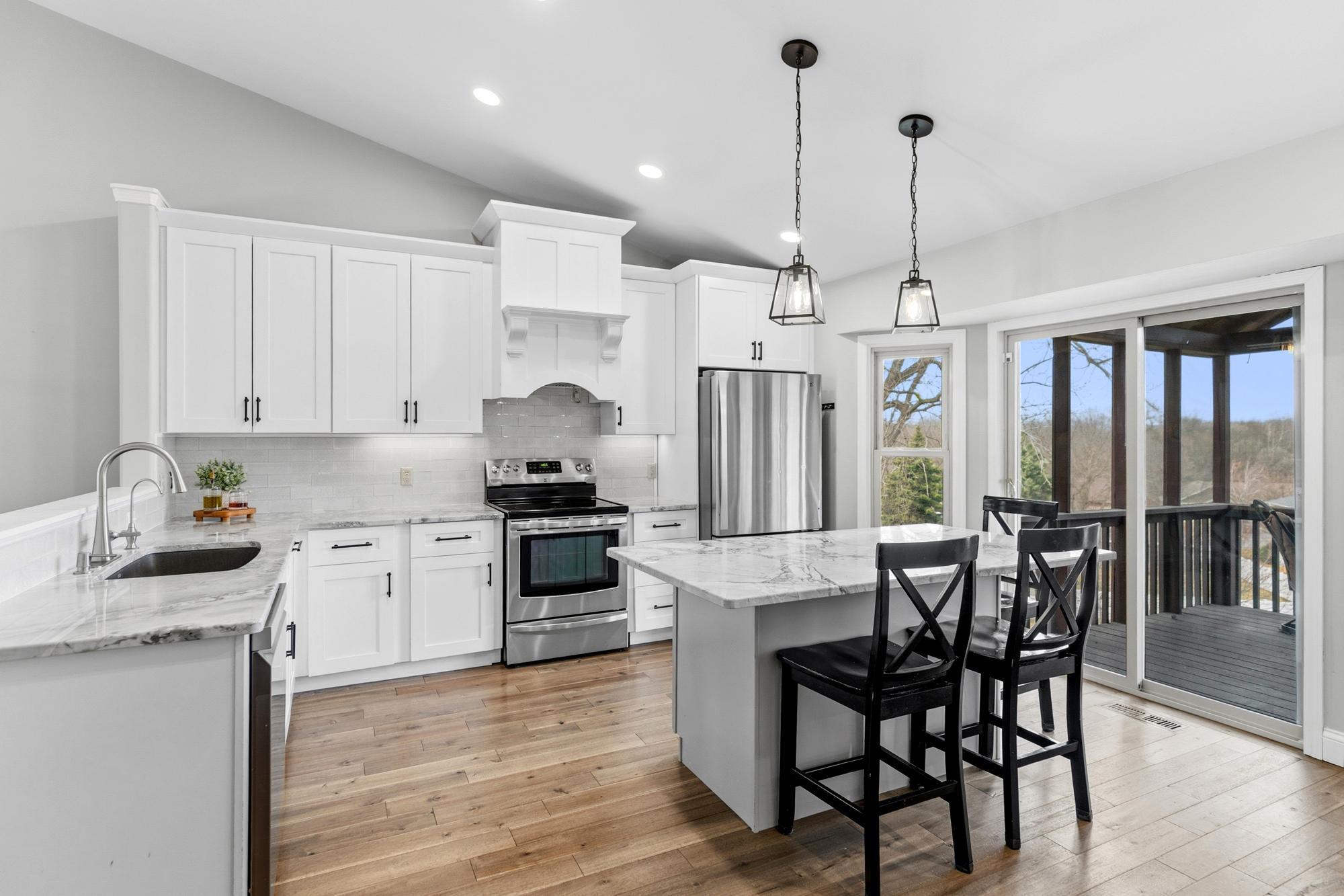 Stainless appliances, granite counter tops, an architectural hood, upgraded lighting...