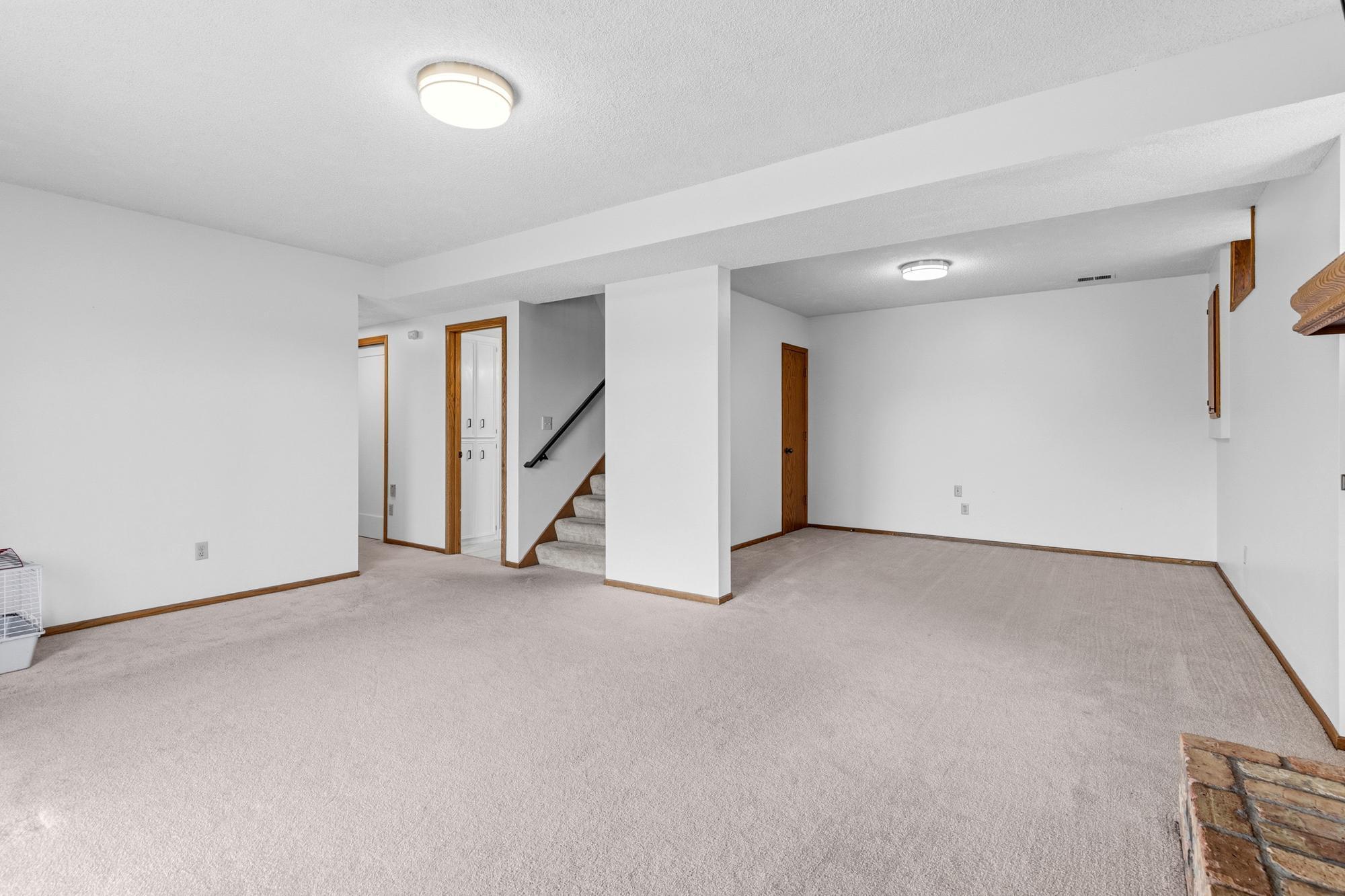 Looking back toward the stairway, the first room down the hallway is the three-quarter bath that serves the lower level.